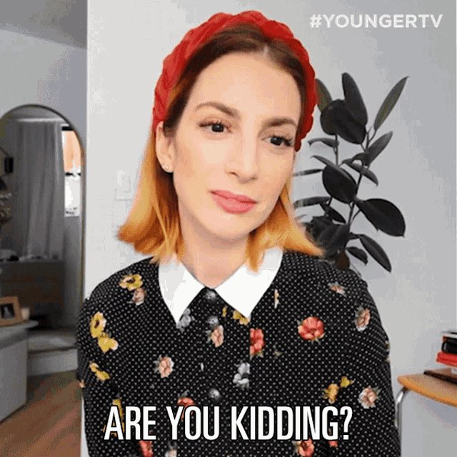 a woman wearing a red headband says " are you kidding ? "