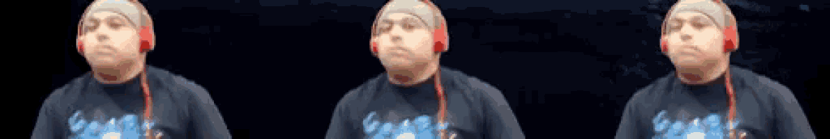 a man wearing headphones and a shirt that says ' ghost '