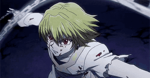 a person with yellow hair and red eyes is holding a chain around their neck .