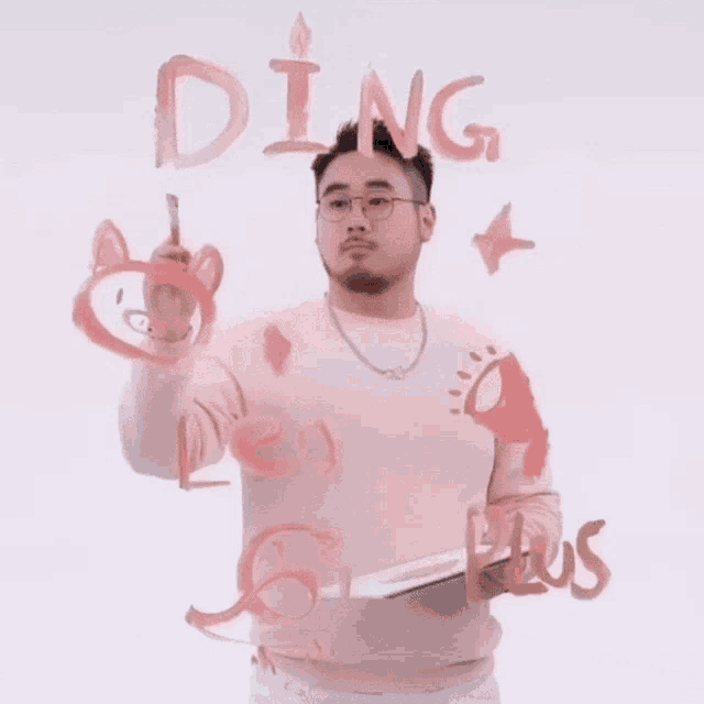 a man in a pink shirt is writing the word ding