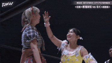 two women in a wrestling ring with tjpw written on the bottom left