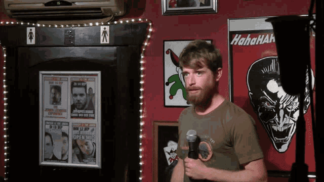 a man stands in front of a sign that says  hahaha