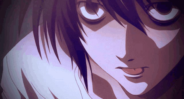 a close up of a person 's face with their tongue hanging out