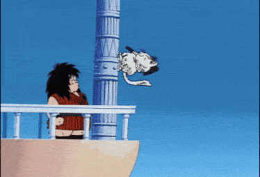 a cartoon cat is sitting on top of a sandy hill