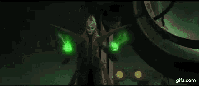 a grim reaper is holding a green lightning bolt in his hands in a dark room .