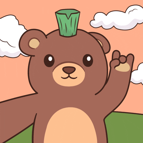 a brown teddy bear with a green object on its head giving a peace sign