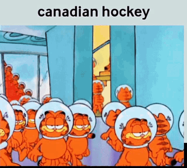 a group of garfield cats wearing space helmets are standing next to each other in a hallway .