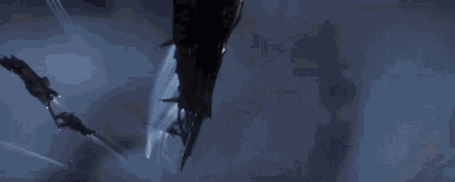 a group of fighter jets are flying through the air