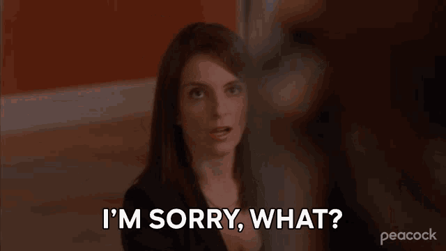 a woman says " i 'm sorry what " in front of a peacock logo