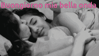 a black and white photo of two women hugging each other