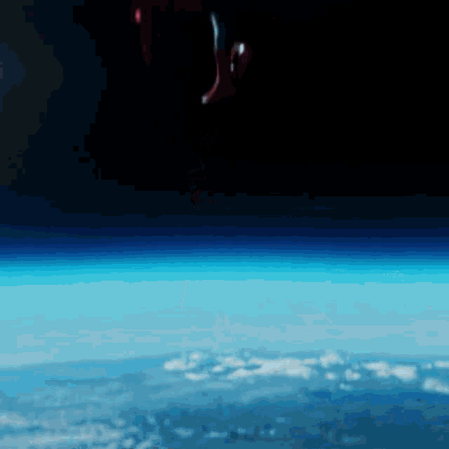 an aerial view of the earth from space with a few clouds