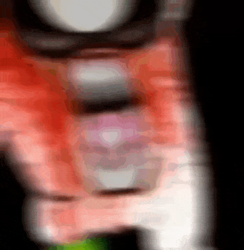a blurred image of a person 's face with a red shirt
