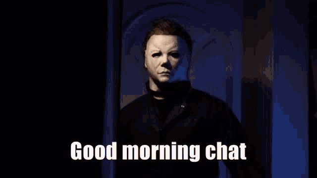 a man in a mask says good morning chat in a dark room