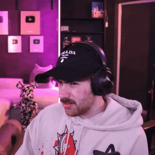 a man wearing headphones and a hat with canada on it
