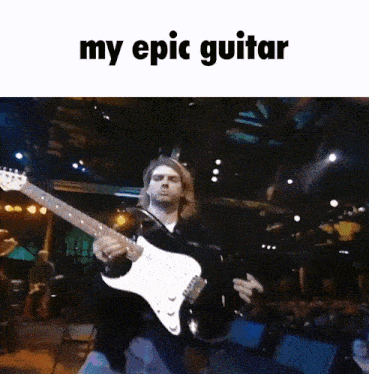 a man is playing a guitar in front of a crowd with the caption my epic guitar