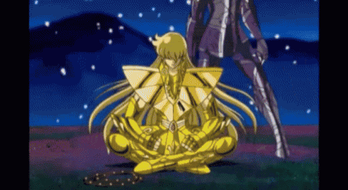 a cartoon character is sitting on the ground with a chain around his feet