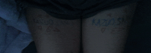 a person 's thighs are painted with the name kazuo