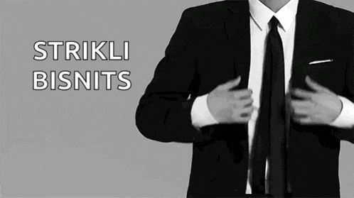 a black and white photo of a man in a suit and tie with the words strikli bisnits above him