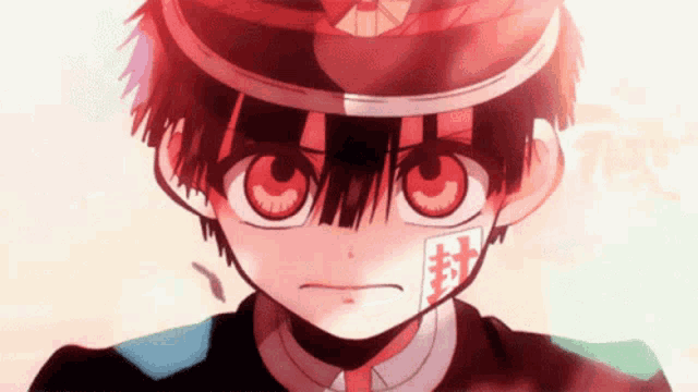 a close up of a cartoon character with red eyes and a red hat