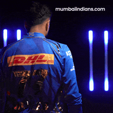 a man in a blue shirt with dhl on the back