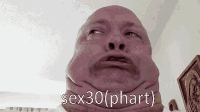 a man making a funny face with the words sex30 ( phart ) written on his neck
