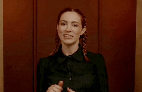 a woman says they make really good friends in front of a wooden wall