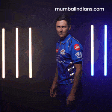 a man in a blue jersey with jio written on the sleeve