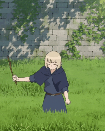 a man in a blue cape is standing in the grass with a stick in his hand