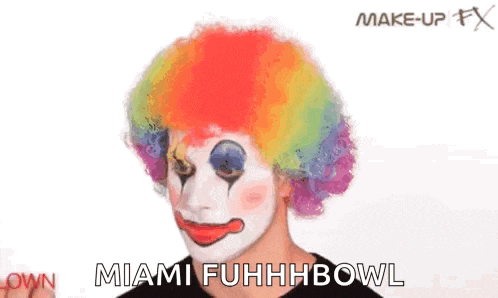 a person is applying makeup to a clown 's face and says miami fuhhhhbowl .