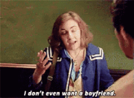 a woman in a blue jacket is talking to a man and says i don 't even want a boyfriend .