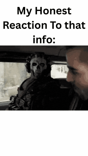 a man with a skull on his face is sitting in a car with another man .