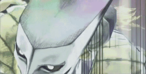 a close up of a person 's face with a white mask on their head .