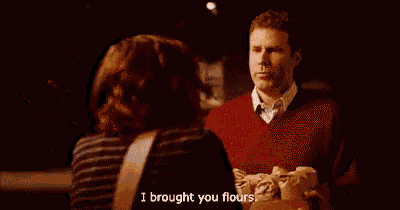 a person is holding a cardboard box that says i brought you flours .