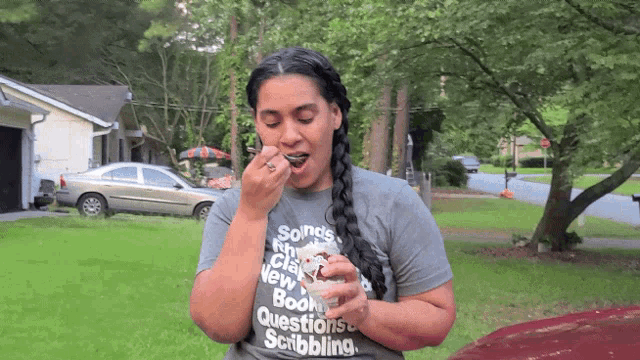 a woman wearing a t-shirt that says scribbling on it