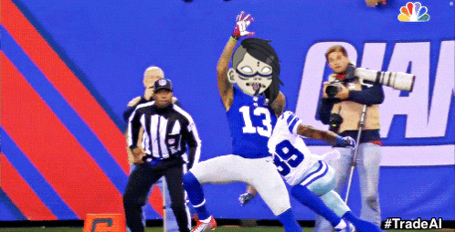 a football player with the number 13 on his jersey is being tackled by another player