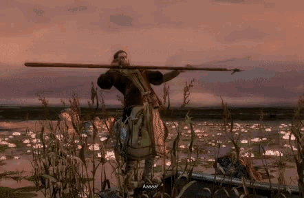 a man in a video game is holding a long spear and says aaaaa