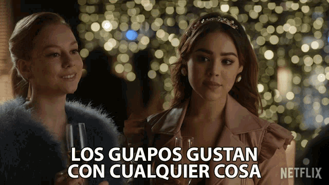 two women standing next to each other with the words los guapos gustan con cualquier cosa on the bottom right