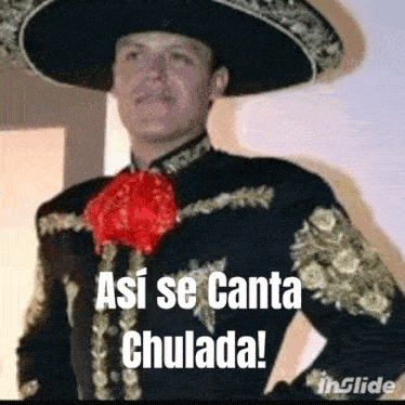 a man in a mariachi outfit is standing with his hands on his hips and says asi se canta chulada !