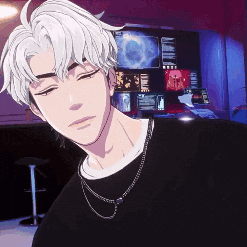 a man with white hair is wearing a black sweater and a necklace