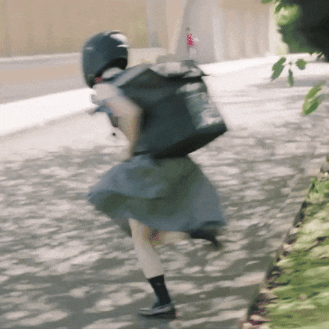 a woman wearing a helmet and carrying a bag that says ' abercrombie & fitch ' on the back