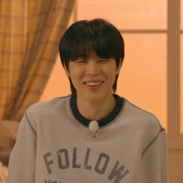 a young man wearing a sweatshirt that says follow on it