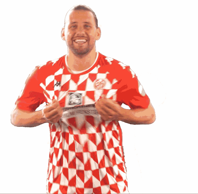 a man wearing a red and white shirt that says merlin