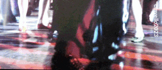a blurred image of people walking with the year 2023 on the bottom left
