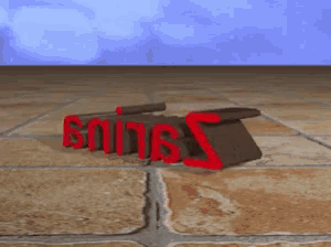 the word sniper is written in red letters on a tiled floor