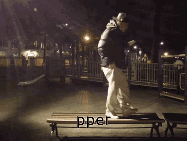 a person is jumping over a wooden bench with the word pper written below them