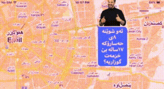 a man is giving a thumbs up in front of a map