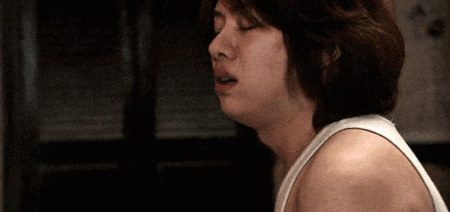 a close up of a person 's face with their mouth open