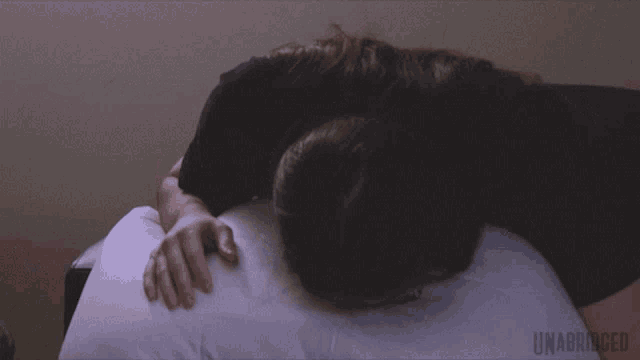 a person laying on a pillow with the word unabridged written on the bottom