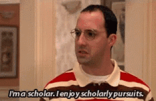 a man in a striped shirt is saying i 'm a scholar .