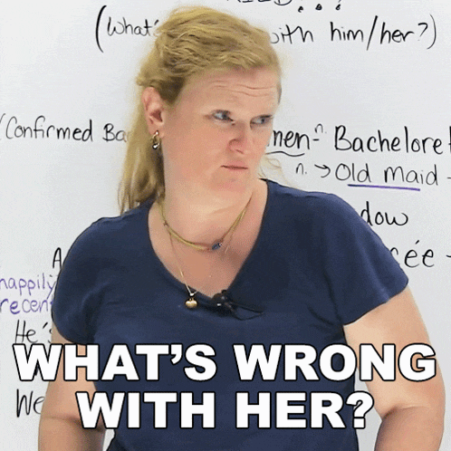 a woman stands in front of a whiteboard with the words what 's wrong with her